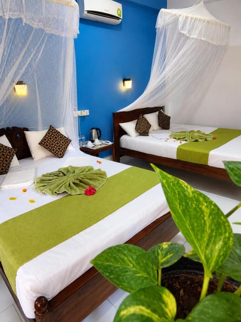 Bed, Photo of the whole room, Bedroom, towels, air conditioner
