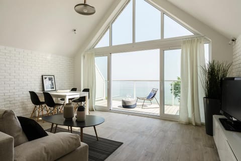 Property building, Living room, Seating area, Dining area, Sea view