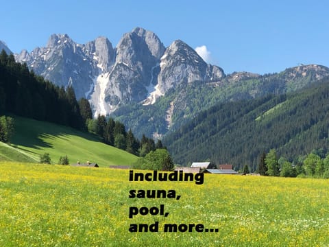 Property building, Nearby landmark, Spring, Day, Property logo or sign, Natural landscape, Text overlay, Mountain view