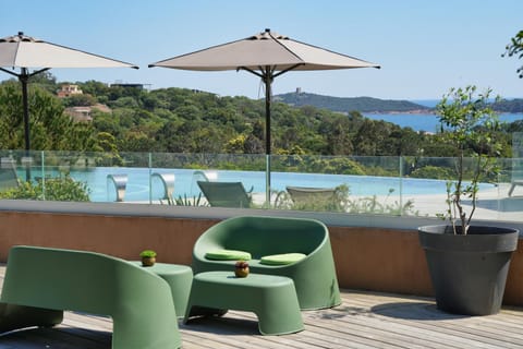 Patio, Restaurant/places to eat, Sea view, Swimming pool