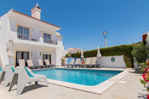 Property building, Swimming pool, Swimming pool, sunbed