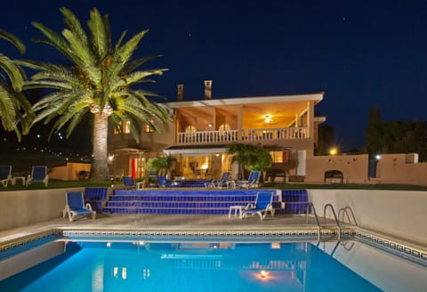 Property building, Patio, Night, Pool view, Swimming pool, sunbed