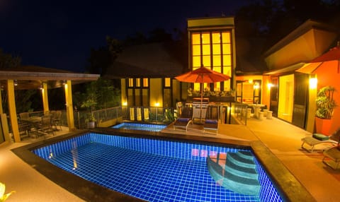 Property building, Patio, Night, BBQ facilities, Balcony/Terrace, Seating area, Swimming pool, sunbed