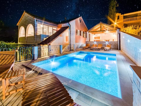 Property building, Night, Pool view, Swimming pool, sunbed