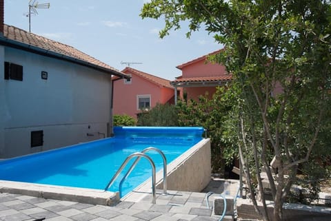 House with outdoor pool in Tisno Apartment in Tisno