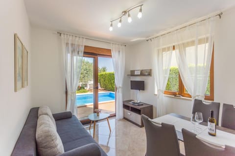 Living room, Seating area, Pool view