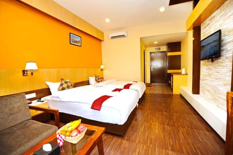 Bed, TV and multimedia, Living room, Decorative detail, Seating area, Bedroom, towels, air conditioner
