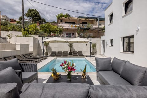 Property building, Patio, Day, View (from property/room), Balcony/Terrace, Living room, Seating area, Pool view, Swimming pool, sunbed