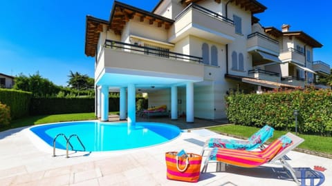 Property building, Patio, Garden, Garden view, Swimming pool, sunbed