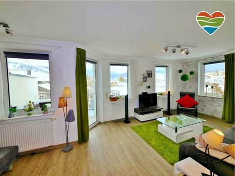 View (from property/room), Living room, Seating area, City view, Lake view, Mountain view