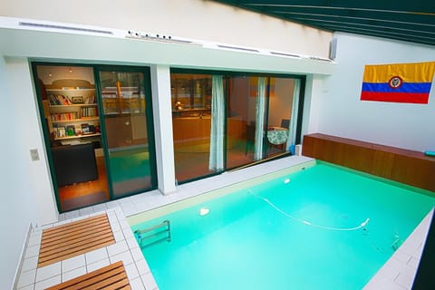 Patio, Communal lounge/ TV room, People, People, Library, Decorative detail, Decorative detail, On site, Pool view, Swimming pool, Family, Family