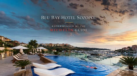 Nearby landmark, Day, Property logo or sign, Natural landscape, Logo/Certificate/Sign, Text overlay, Pool view, Sea view, Swimming pool, Sunrise, Sunset, Certificate/Award, sunbed