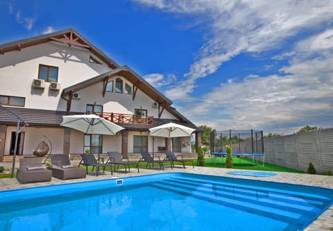 Property building, Pool view, Swimming pool, sunbed