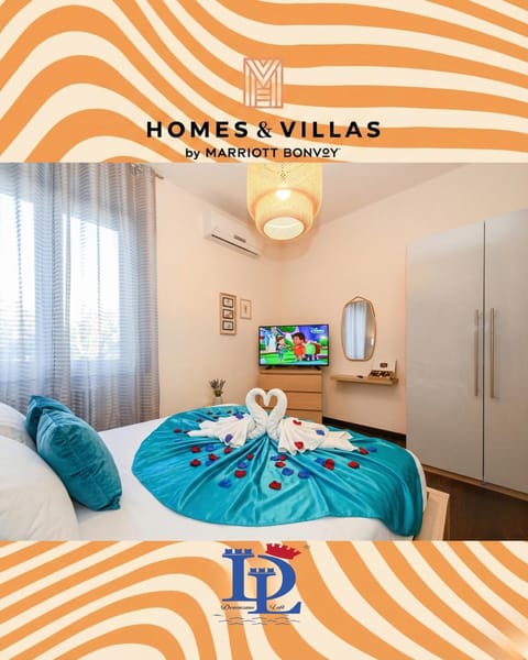 Bed, TV and multimedia, Photo of the whole room, Logo/Certificate/Sign, Bedroom, Text overlay, towels