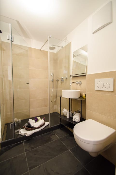 Shower, Toilet, Bathroom, hair dryier, towels