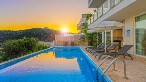 Natural landscape, View (from property/room), Swimming pool, Sunset, sunbed