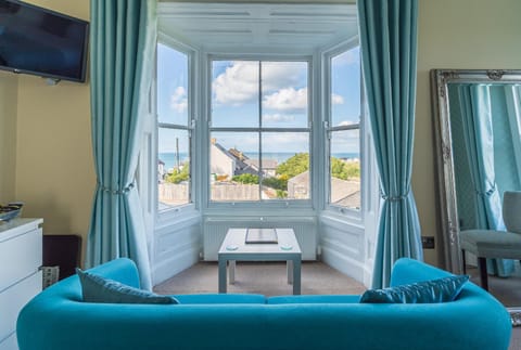 Natural landscape, TV and multimedia, Seating area, Bedroom, Sea view