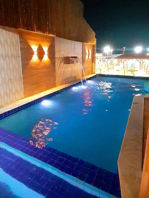 Property building, Night, Pool view, Swimming pool, sunbed
