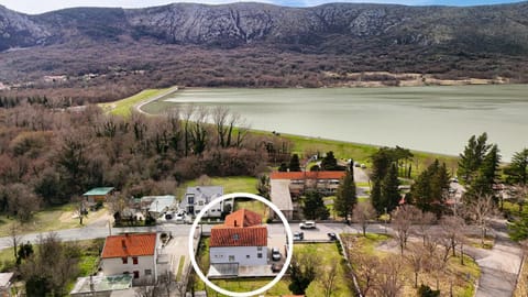 Property building, Spring, Day, Neighbourhood, Natural landscape, Bird's eye view, Lake view, Mountain view