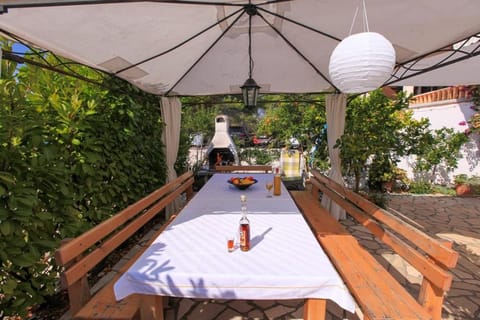 Property building, BBQ facilities, Seating area