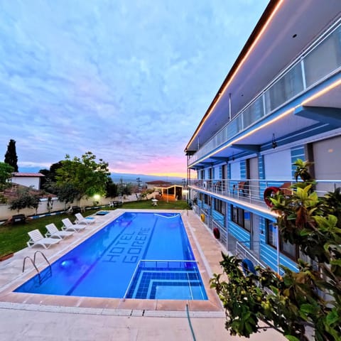 Property building, Day, Pool view, Swimming pool, Sunset, sunbed