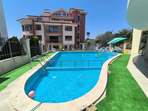 Property building, Pool view, Swimming pool, sunbed