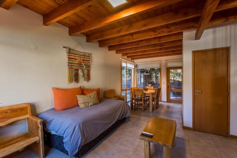 Bed, Living room, Seating area, Dining area