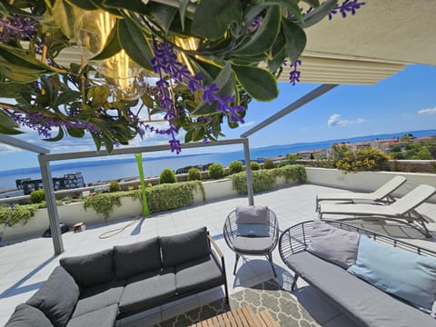 Patio, Day, View (from property/room), Balcony/Terrace, Living room, Seating area, Garden view, Sea view