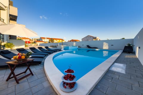 Property building, Seating area, Swimming pool