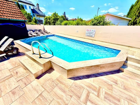 Swimming pool, sunbed