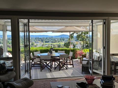 Property building, Patio, Seating area, Dining area, City view