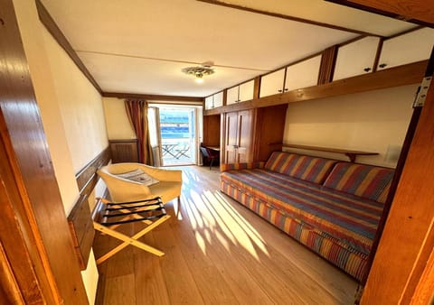 Bed, Living room, Seating area, Bedroom