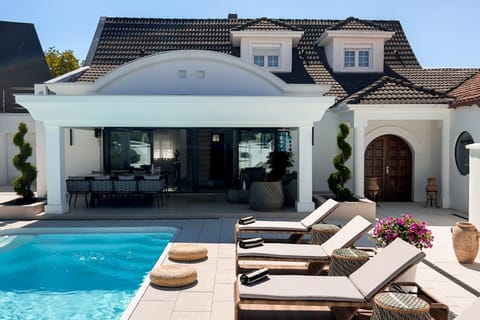 Property building, Patio, Day, Pool view, Swimming pool