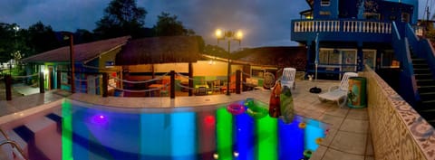 Property building, Patio, Night, Pool view, Swimming pool, sunbed