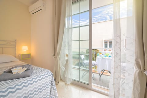 Bed, Photo of the whole room, Bedroom, towels, air conditioner