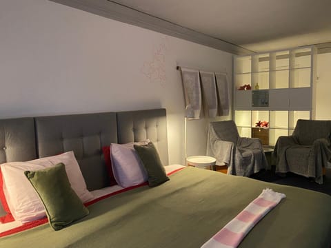 Bed, Living room, Seating area, Bedroom