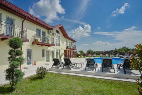 Property building, Pool view, Swimming pool, sunbed
