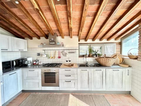 Kitchen or kitchenette, dishwasher, microwave, oven, stove