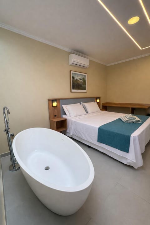 Bed, Bathroom, Photo of the whole room, Bedroom, Bath, minibar, towels, air conditioner