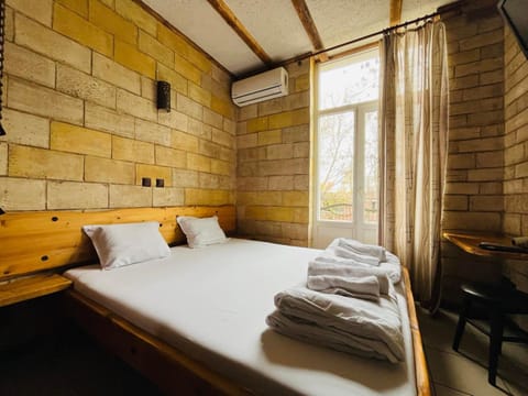 Bed, Photo of the whole room, towels, air conditioner