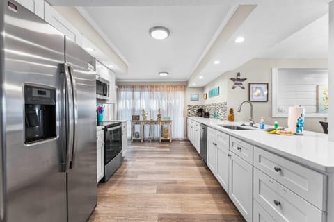 Kitchen or kitchenette, dishwasher, oven, stove