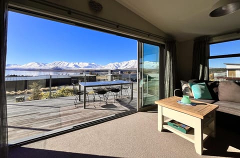 Property building, Patio, Living room, Seating area, Lake view, Mountain view, Mountain view
