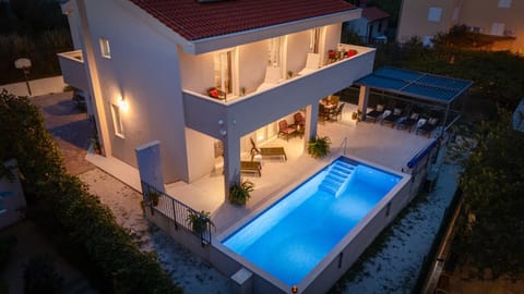 Property building, Patio, Night, Pool view, Swimming pool, sunbed
