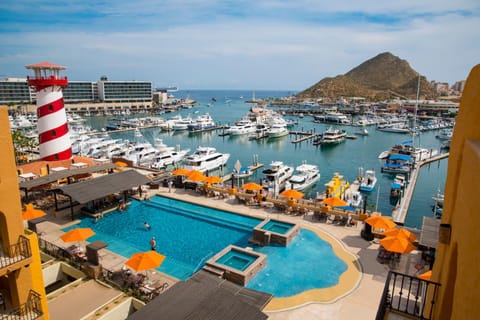 Property building, Nearby landmark, Day, Natural landscape, Activities, Pool view, Sea view, Swimming pool, sunbed