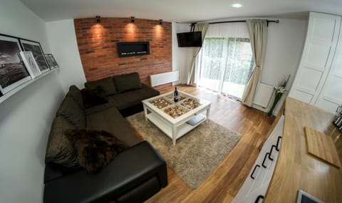 Bed, TV and multimedia, Living room, Seating area, Garden view