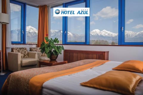 Bed, Property logo or sign, Natural landscape, Bedroom, Text overlay, Mountain view