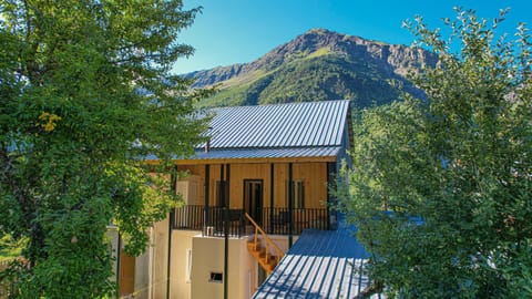 Property building, Nearby landmark, Spring, Day, Natural landscape, Mountain view