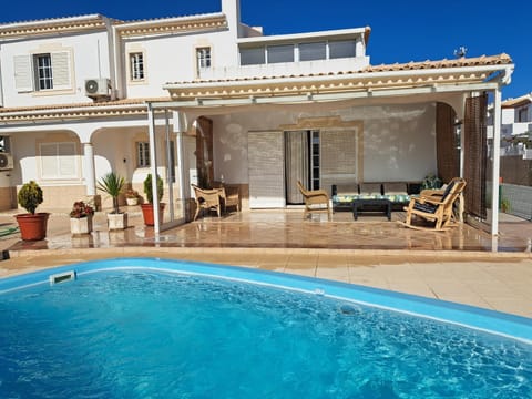 Property building, Living room, Swimming pool