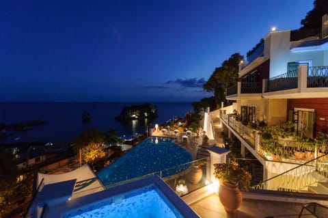 Property building, Night, View (from property/room), Pool view, Sea view, Swimming pool