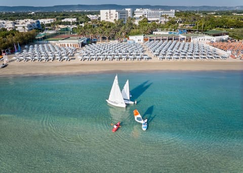 Property building, Nearby landmark, Day, Natural landscape, Bird's eye view, Beach, Sea view, Swimming pool